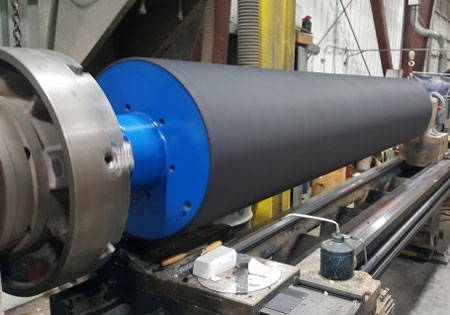 Our 12,000 square foot custom built facility with full service machine shop was built for one purpose: Manufacturing high quality, precision machined rollers. We have can produce rollers up to 32 x 120 inches. We also have capabilities to recover, resurface and remanufacture old and worn rubber rollers and printing rollers.